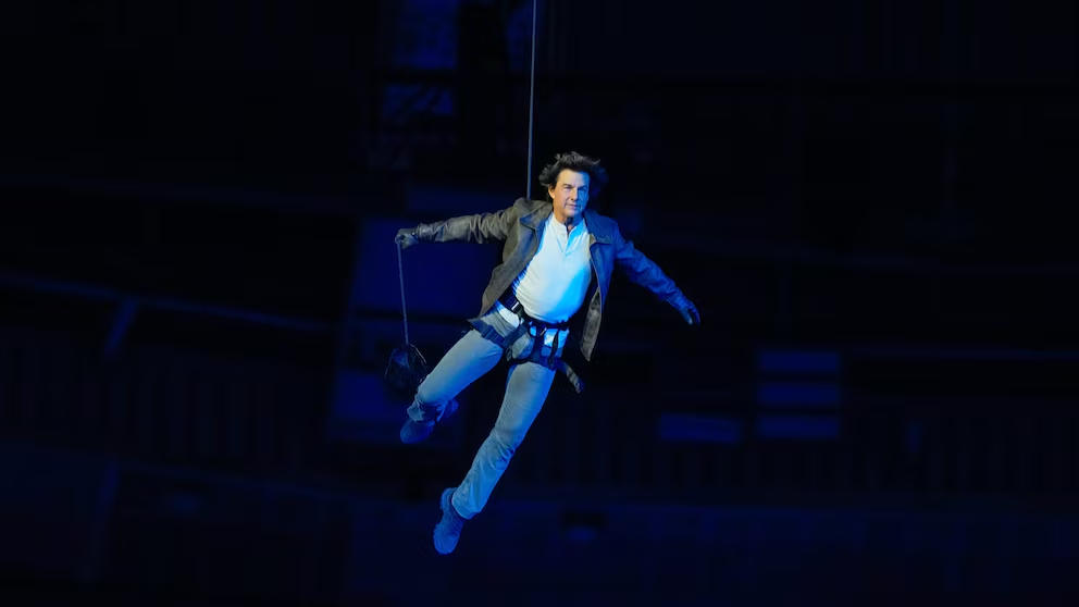 Tom Cruise presents Los Angeles with an Olympic flag