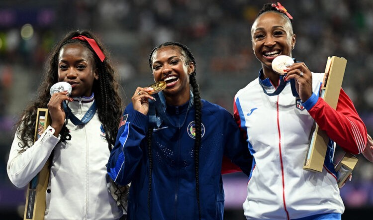 Entire Olympic 100m hurdles podium signs for Grand Slam Track